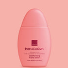 A pink bottle of Avon Her Wisdom Comforting Hand Elixir, centered against a matching solid pink background.